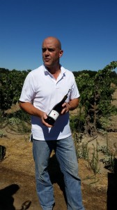 Michael MacCay of @MacCayCellars with a bottle of his Carignane made with old vine fruit from the Rausch Vineyard. @Lodi_Wine @alltheswirl.