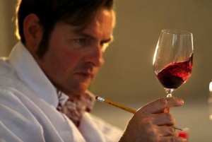 Judge Christopher Sawyer checks the color of a zinfandel at the Sonoma County Harvest Fair wine competition. (JOHN BURGESS / The Press Democrat)